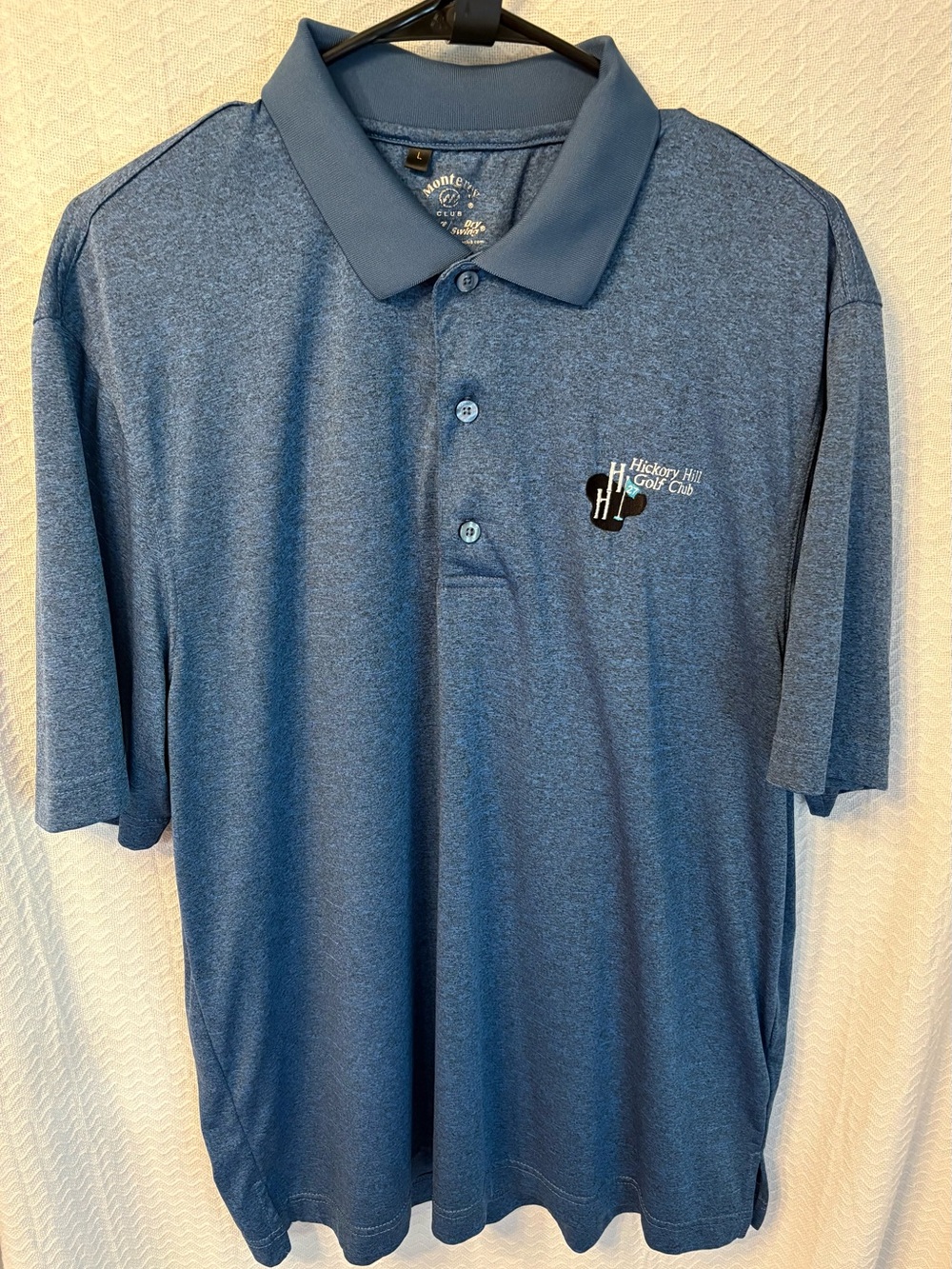 Monterey club dry comfort, heathered blue polo golf shirt with golf logo. Size L